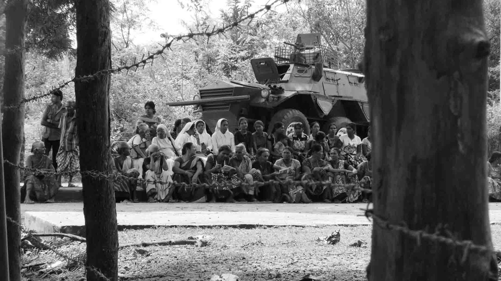 People protesting in front of an Army camp in Keppapulavu in the Mullaithivu District demanding the release of their lands.
