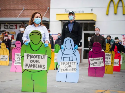 Faith and community leaders held silhouettes of striking workers, unable to attend due Covid-19.